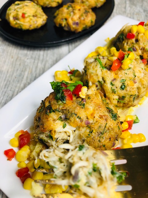 Crab Cakes topped with Corn Salad on a bed of Garlic Whipped Mashed Potatoes